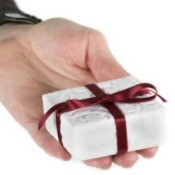 Hand Holding Small Christmas Gift