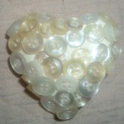 Buttons made into a heart shaped pin.