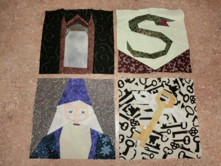 Four quilt blocks including Dumbledore.