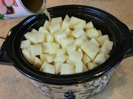adding chicken broth