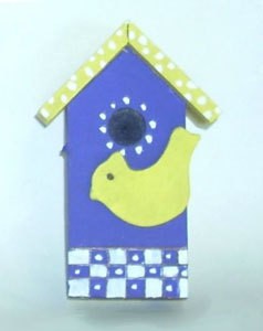 Decorative blue and yellow birdhouse.