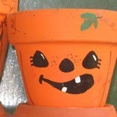 Clay pots decorated with Jack-O-Lantern Faces