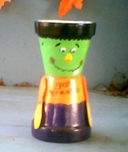 Craft Ideas   Cream Sticks on Two Clay Pots Decorated To Make A Smiling Frankenstein Monster Candy