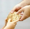 Giving bread to the needy.