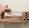 Adjust a home's thermostat.
