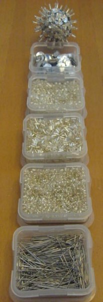 Supplies arranged in order of usage with finished ornament at top.