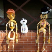 Decorations sitting on patio wall.