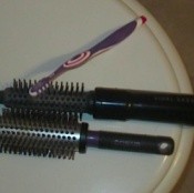 Clean Your Hairbrush With A Toothbrush
