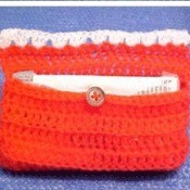 Crochet pouch for purse size tissue package.