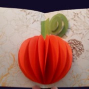 A popout orange pumpkin card