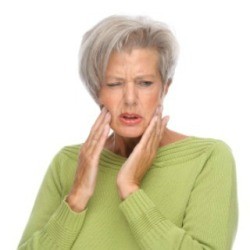 Should you wear dentures while letting raw sores heal in your mouth?