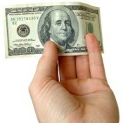 Hand Holding $100 Bill
