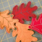 Attaching leaves to each other with buttons.