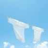White t-shirts hanging on a clothesline.