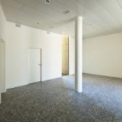 A photo of a large room with granite floors.
