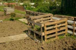 Compost pile made with wood pallets.