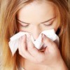 A woman suffering from allergies.