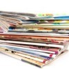 A large stack of food magazines.
