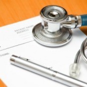 Photo of a prescription pad and stethoscope.