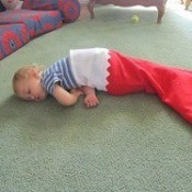 Child in large Christmas stocking.