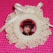 Photo frame with lace edging.
