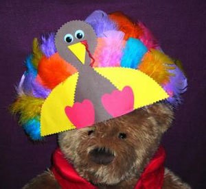 Paper hat in shape of turkey with feathers.
