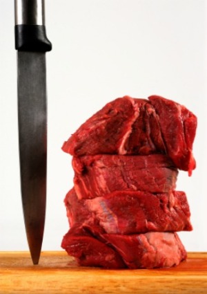 A stack of raw beef tenderloin.
