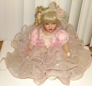 Doll in tiered pink dress.