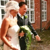 Rice being thrown at newly weds.