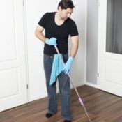 Man Removing Wax From Laminate Flooring