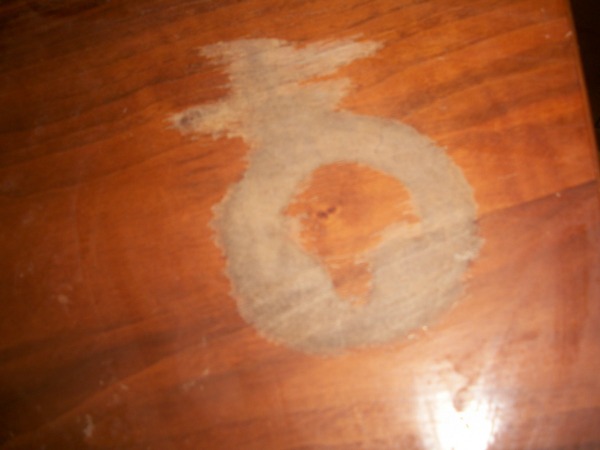 How do you fix a table when you put nail polish remover on it?