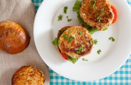 Two tuna burgers on a white plate