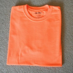 A perfectly folded orange T-shirt.
