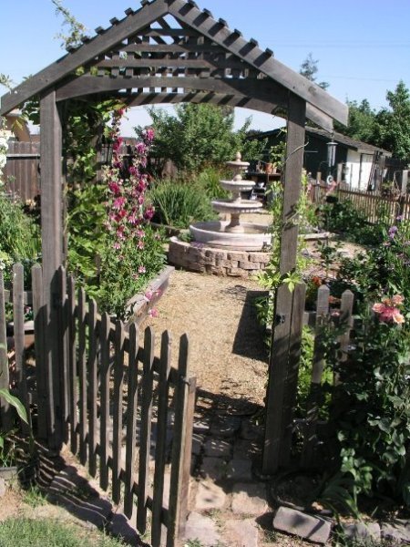 gate open to garden and fountain