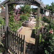 gate open to garden and fountain