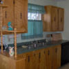View of kitchen sink and surrounding cupboards