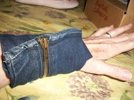 A wrist wallet made out of recycled denim jeans.