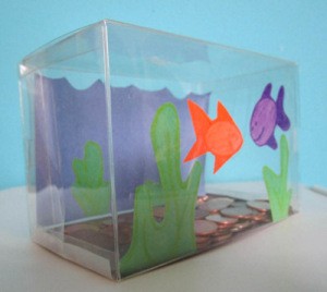 fish tank bank with orange and purple fish cutouts on front