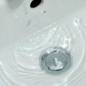 Retrieving Jewelry Dropped in a Sink Drain, Water dripping in bathroom sink
