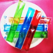 Six colorful ice pops ready for the freezer.