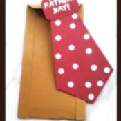 Father's Day red polka dotted tie card with brown envelope.