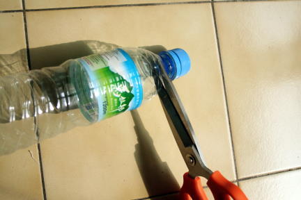 Cut water bottle top off plastic bottle.