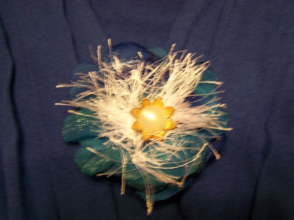 A blue silk flower pin.