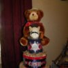 A cowboy themed diaper cake for a baby shower, in red and blue.