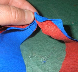 Close up of crepe paper ready to be attached.