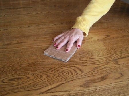 Use a piece of cardboard instead of fine sandpaper on wood.