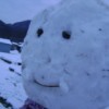 A close up of a snowman's face.