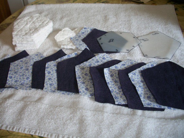 Fabric cut out for assembling quilted fabric bowls.