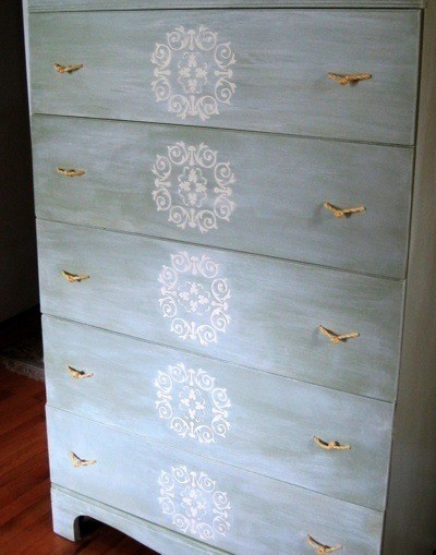 An old dresser fixed up with rope drawer handles.
