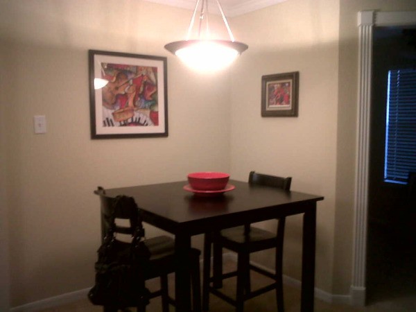 Small dining table in corner of room